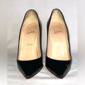 Black Christian Louboutin pointy toe patent calf leather pumps.